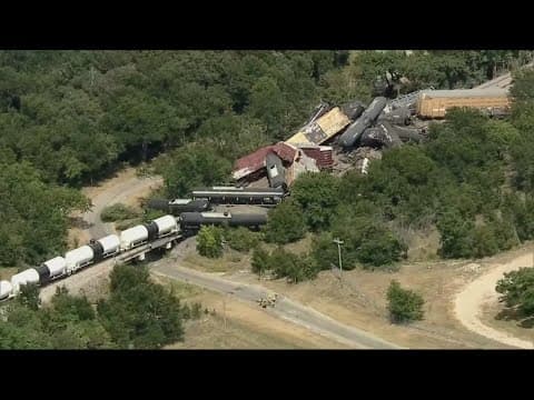 Crews work to clean up a major train derailment involving harmful chemicals