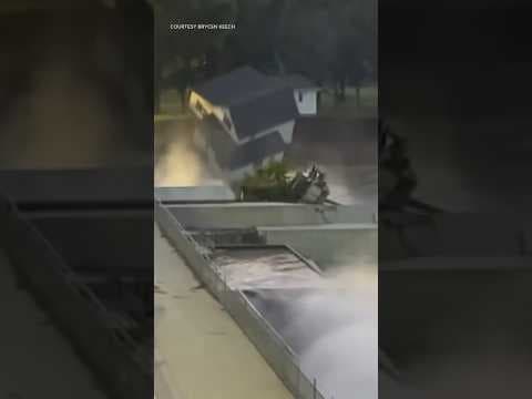 Watch and listen as bystanders witness a home collapse into the river next to the Rapidan Dam.