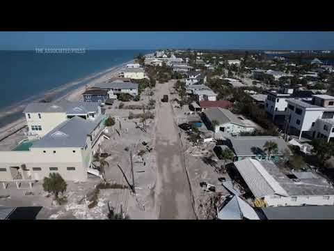 Florida digs out of mountains of sand swept in by back-to-back hurricanes