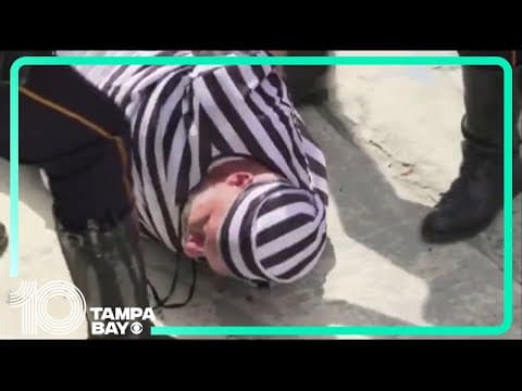 Protester dressed in prison stripes arrested after Trump's arraignment