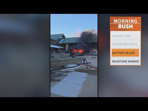 Trucks burst into flames outside Cabelas