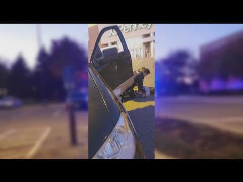 Woodbury police officer dragged from stolen vehicle, bystanders provide assistance