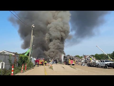 Crews knock down large fire at auto salvage yard on Indy's west side
