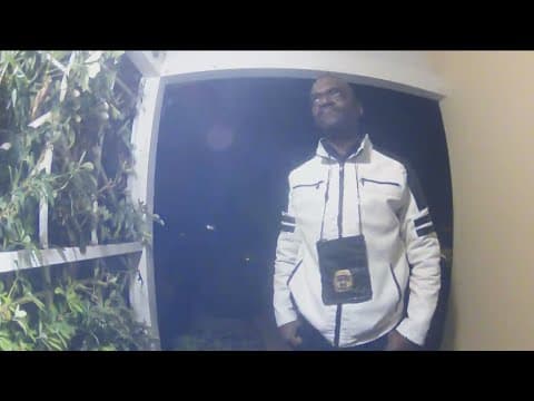 Police investigating man with badge knocking on doors for help