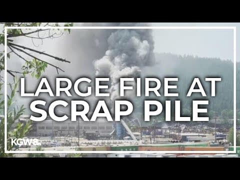 Large pile fire sends up plume of smoke over North Portland