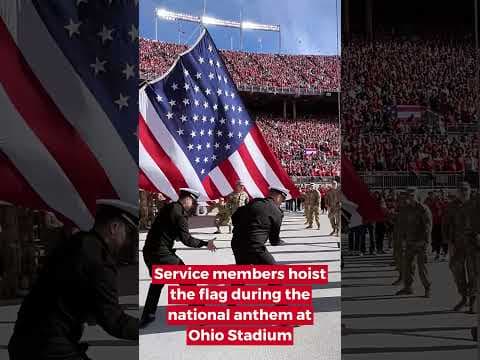 Service members hoist the flag during the national anthem at Ohio Stadium #shorts