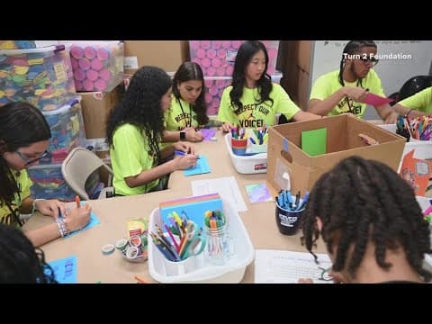 Students with Turn 2 Foundation help fill backpacks