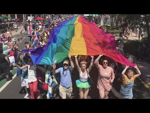 San Diego Pride Parade | Hundreds come together to carry a 300 foot Pride flag at the conclusion