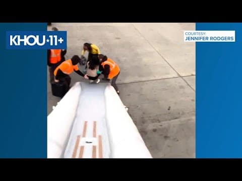 Video shows passengers evacuating flight in Denver after a battery fire