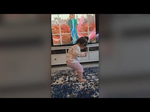A toddler loves dancing to "creepy" Halloween music