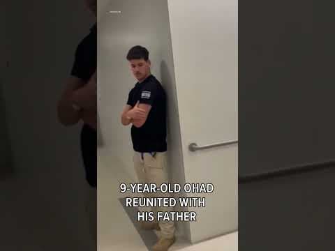 Young former Israeli hostage reunites with father