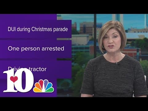 Person in custody after he is accused of driving tractor under the influence during a parade