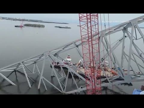 Salvage teams prepare to remove section of bridge from atop Dali