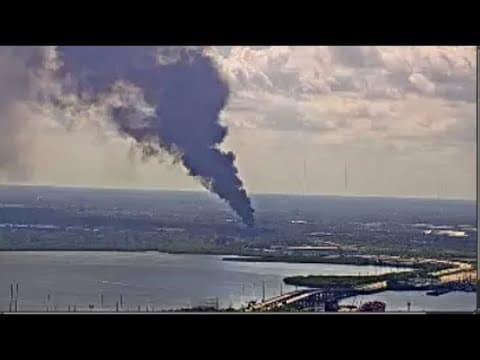 Large cloud of smoke over Tampa scrapyard after fire