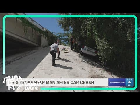 Neighbors help man stuck behind wheel after car crashes into embankment