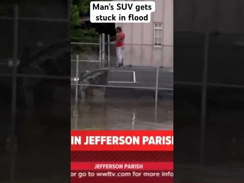 A man in a SUV stalled driving through deep flood waters near Airline Drive he ended up on the roof.