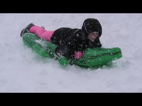 Residents ski on Bourbon Street, sled down the levee during historic New Orlean snow day
