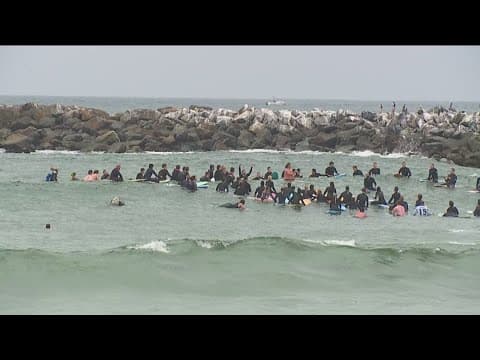 Hundreds gathered at Ocean Beach Dog Beach for paddle out to remember killed surfers