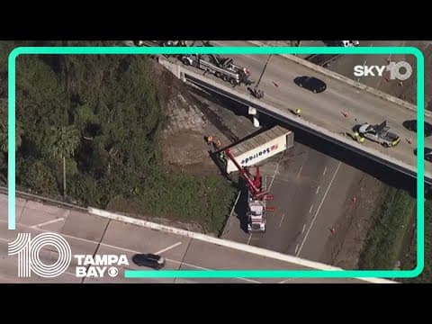Woman still in hospital after semi-truck's trailer falls from overpass, hitting her Jeep