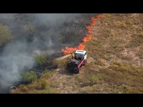 VIDEO: First responders putting out grass fire in North Texas