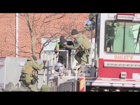 Armed man in custody after barricading on roof of Fairfax County apartment building