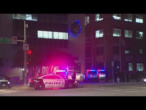 Shooting suspect taken into custody after walking out of Dallas police headquarters, sources say
