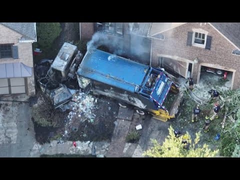 Garbage truck driver loses control, crashes into parked car at Georgia home