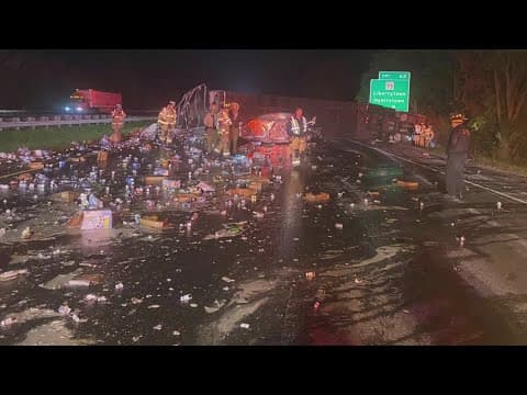 18-wheeler rollover crash spills cases of beer all over I-70 E