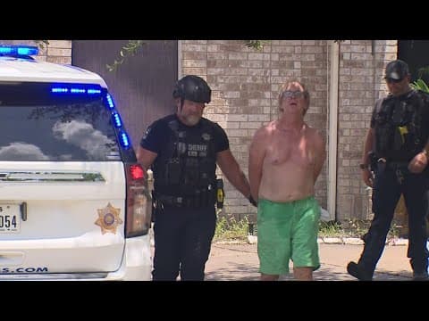 A man who neighbors say threw a sledgehammer and feces at their home arrested