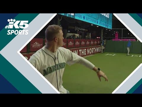 Jake and Mimi test out their pitching skills in Mariners' bullpen ahead of Opening Day