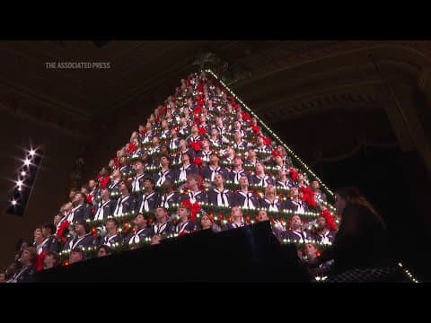 Dozens of Michigan high school choir students perform in 67-foot Singing Christmas Tree