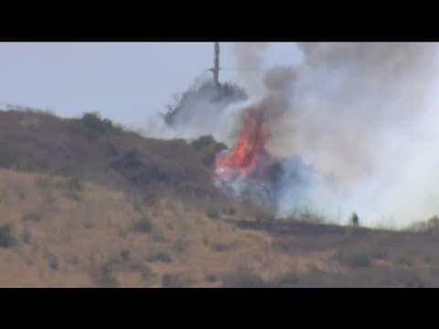 Brush fire contained after threatening homes in Oceanside, prompting evacuations