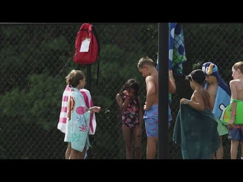 Elementary schoolers learning a lifesaving skill: swimming
