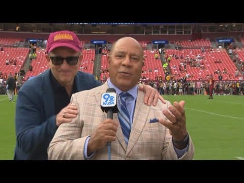 Josh Harris "photobombs" Chick Hernandez during Commanders Kickoff