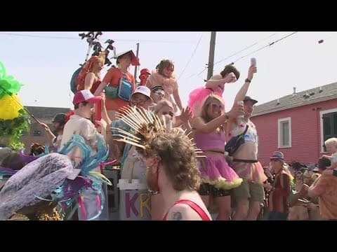 Makeshift floats roll through Marigny