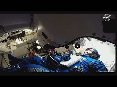 Two astronauts stuck in space won't return to Earth until next month