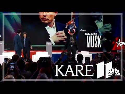 Elon Musk wields chainsaw on stage