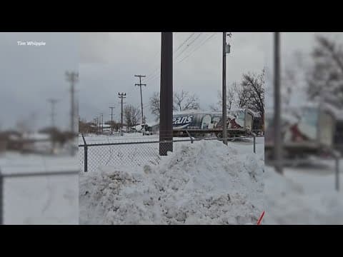 Train collides with 18-wheeler on snowy train tracks