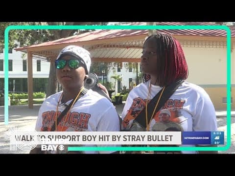 Teen who survived a stray bullet leads community in walk against gun violence