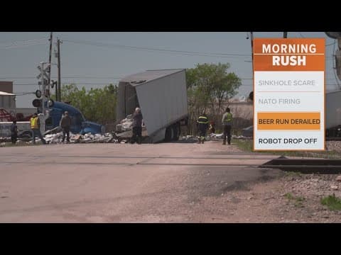 Train hits semi-tuck carrying beer, officials say