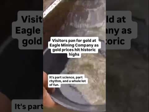 Visitors pan for gold at Eagle Mining Company as gold prices hit historic highs
