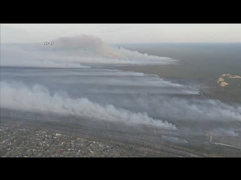 New Jersey residents evacuate as a large wildfire races toward homes