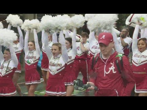 Fans line up to see Sugar Bowl Parade in the French Quarter