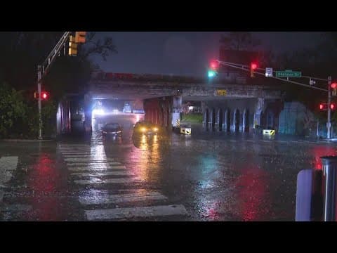 Cars stuck in high water near East 10th Street and North Sherman Drive