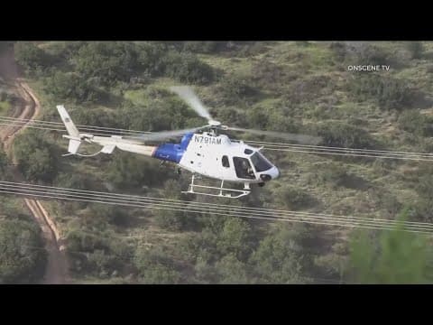 CBP helicopter assists in the arrest of migrants on Otay Mountain