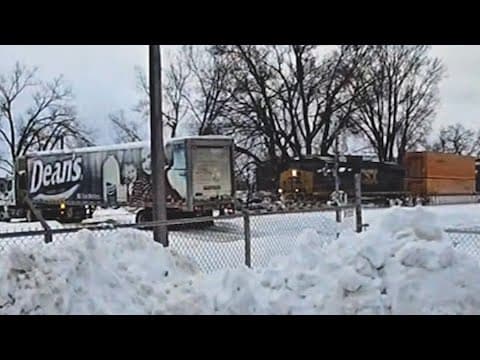 VIDEO: Train crashes into truck stuck on tracks, driver narrowly escapes