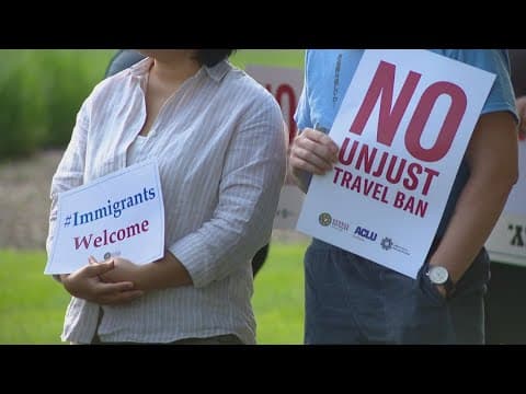 Demonstrators at Indianapolis International Airport protest President Trump's travel ban