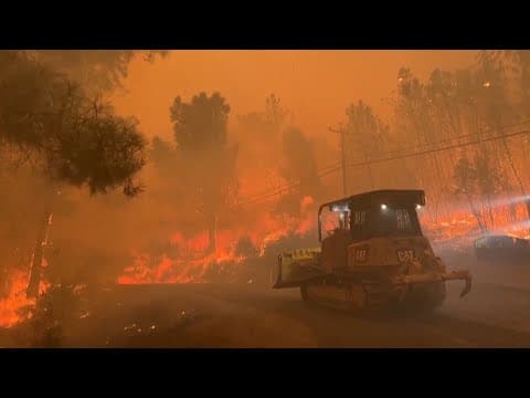 California residents flee massive wildfire sparked by burning car