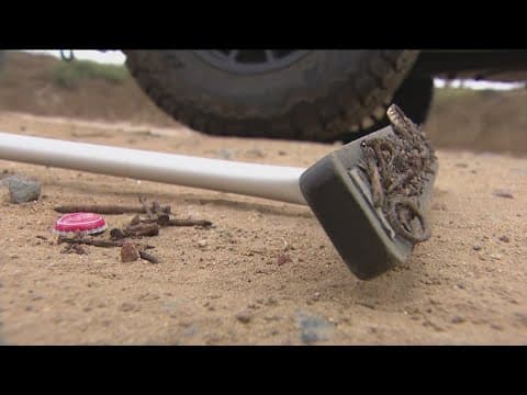 Fiesta Island riddled with nails, glass buried in sand