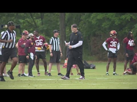 Head coach Dan Quinn sets the tone for rookies and veterans during Commanders OTAs